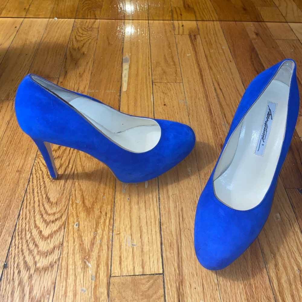 Mildly worn royal blue suede round toe pumps